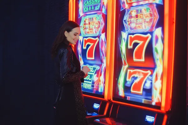 A woman in a luxurious green gown next to an ornate roulette wheel, capturing the upscale casino mood of JL56.