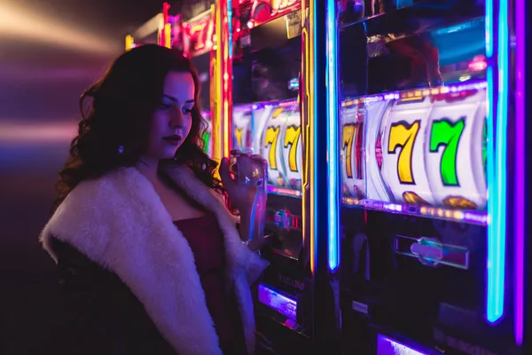 JL56 Mobile Casino — Play anytime, anywhere A player using their smartphone during a festive local event, representing JL56’s fully mobile-friendly casino.